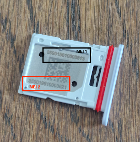 This image shows the SIM card tray with the two IMEI numbers engraved.png